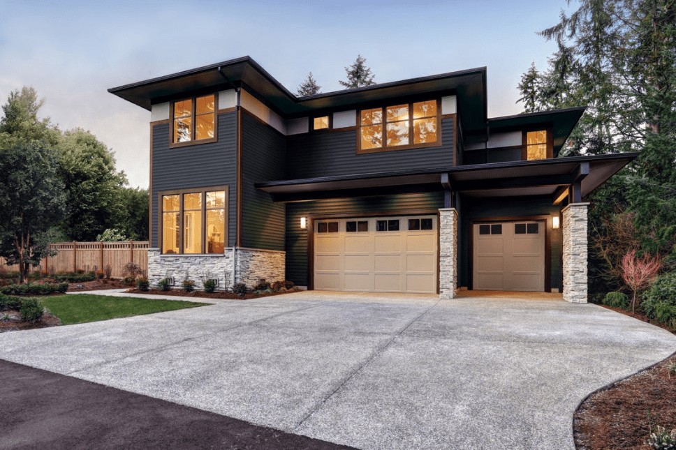 A stylish, modern home with wide, clear windows and a striking design.