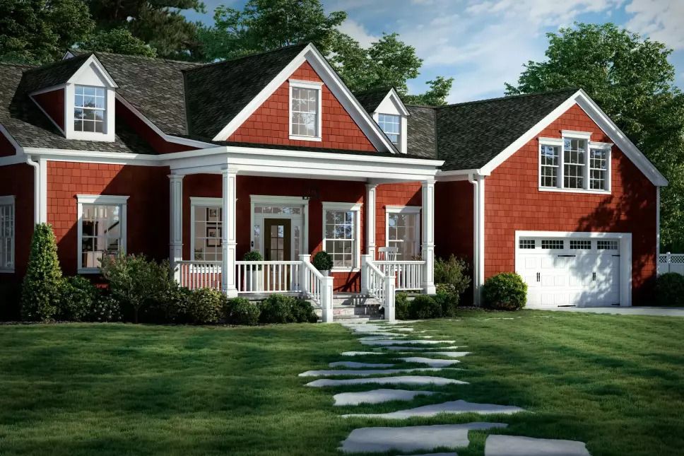 Red house with double-hung windows, a stone walkway, and a white garage door.